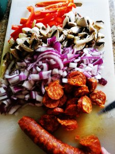Chopped chorizo, red onion, mushrooms and red pepper ready for cooking.